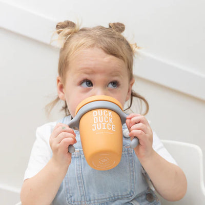 Bella Tunno Duck Duck Juice Happy Sippy Cup made of food-safe silicone with removable handles, soft spout.