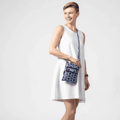Black and white crossbody bag with geometric lattice pattern, three zippered compartments, and a detachable strap for hands-free use.