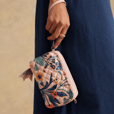 Vera Bradley RFID wallet crossbody in Paradise Coral with quilted cotton, multiple card slots, phone pocket, and zip closure.
