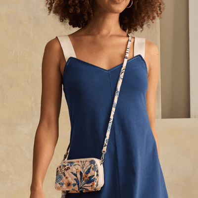 Vera Bradley RFID wallet crossbody in Paradise Coral with quilted cotton, multiple card slots, phone pocket, and zip closure.