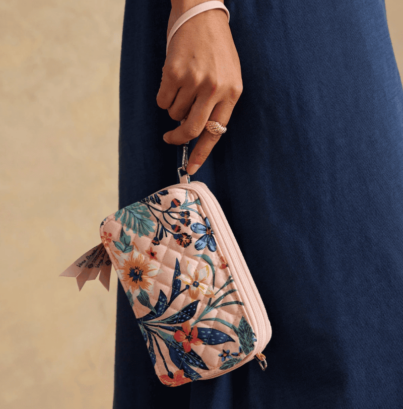 Vera Bradley RFID All in One crossbody in Paradise Coral quilted cotton with card slots, phone pocket, and adjustable strap.
