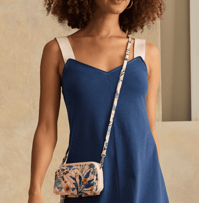Vera Bradley RFID All in One crossbody in Paradise Coral quilted cotton with card slots, phone pocket, and adjustable strap.
