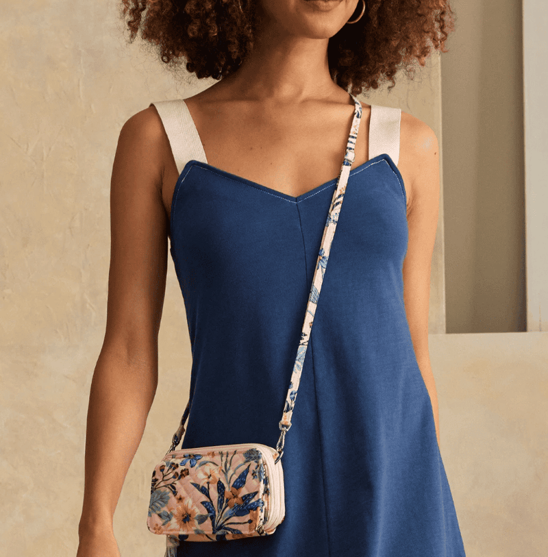 Vera Bradley RFID All in One crossbody in Paradise Coral quilted cotton with card slots, phone pocket, and adjustable strap.
