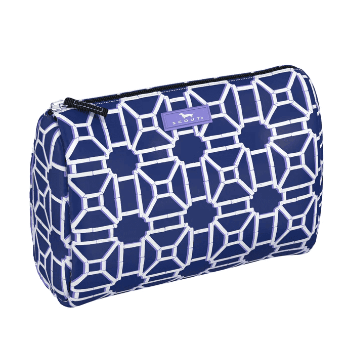 Makeup and travel bag with black and white lattice pattern, interior slip pocket, slim profile, fits full-size bottles 