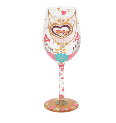 A Lolita brand wine glass with a hand-painted