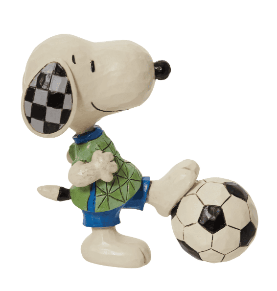 Small dog statue kicking a ball