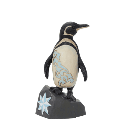  penguin standing on a rock with a star on it".
