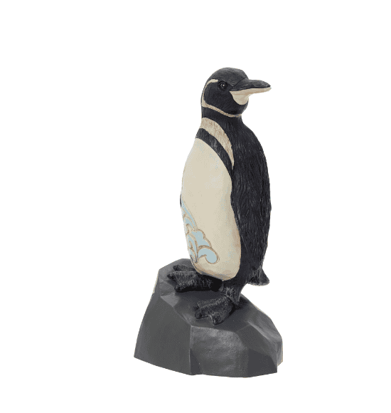  penguin standing on a rock with a star on it".
