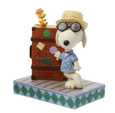 Jim Shore Snoopy and Woodstock vacation figurine with suitcase, Hawaiian shirt, and straw hats, hand-painted in folk art style.