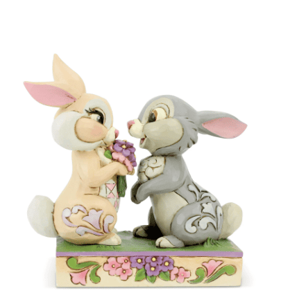 Jim Shore Disney figurine of Thumper and Miss Bunny falling in love, with Flower nearby, hand-painted in folk art style.