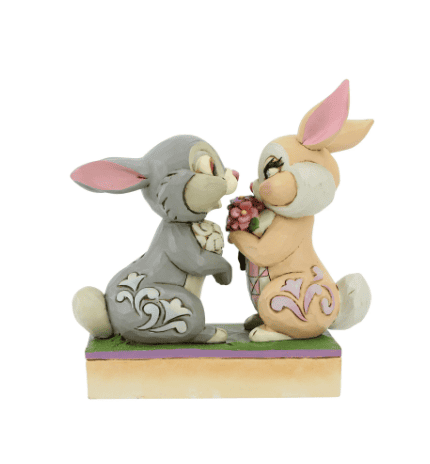 Jim Shore Disney figurine of Thumper and Miss Bunny falling in love, with Flower nearby, hand-painted in folk art style.