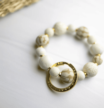 Ivory Palm Small Bead Wrist Keychain with handcrafted clay beads, stretch elastic, and polished spacers.