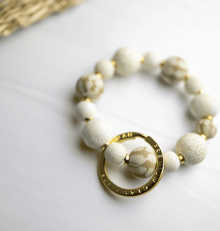 Ivory Palm Small Bead Wrist Keychain with handcrafted clay beads, stretch elastic, and polished spacers.