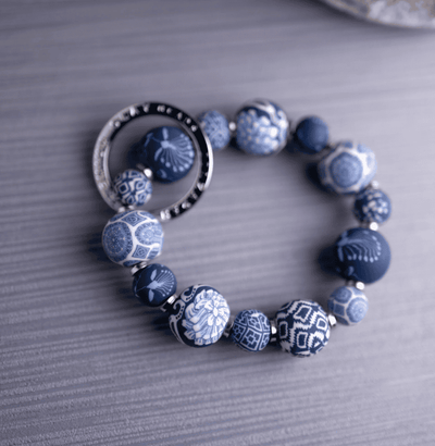 Dutch Blue Small Bead Wrist Keychain with handcrafted blue polymer clay beads, sleek metal spacers, and stretch elastic.
