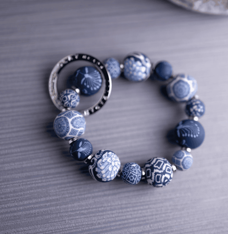 Dutch Blue Small Bead Wrist Keychain with handcrafted blue polymer clay beads, sleek metal spacers, and stretch elastic.