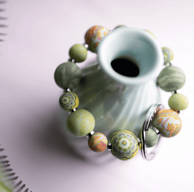 Green Fern Small Bead Wrist Keychain featuring handcrafted green polymer clay beads, metal spacers.