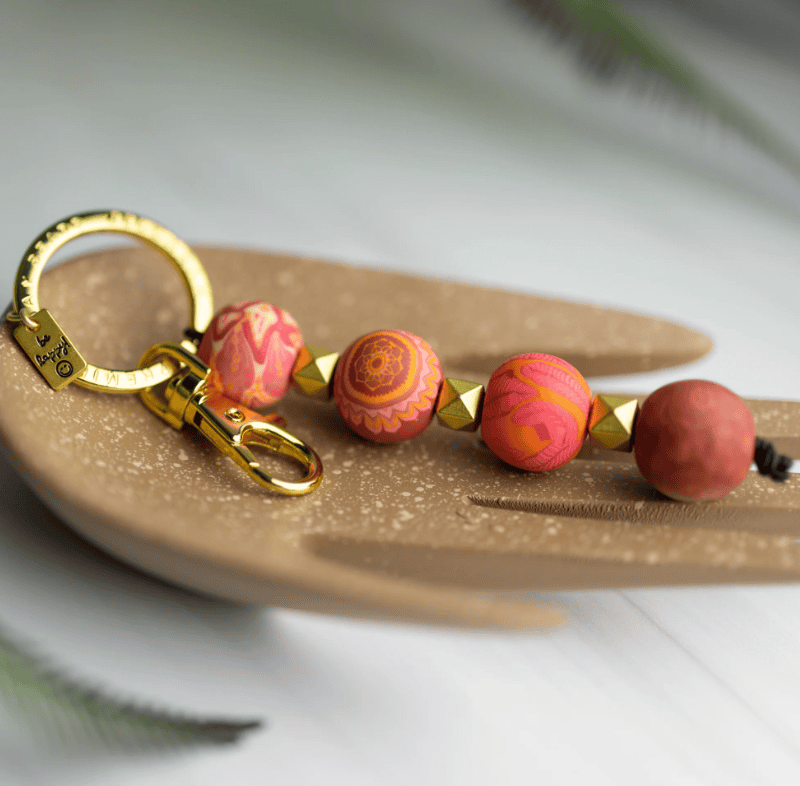Savannah Red 4-Ball Keychain with 18mm handcrafted clay beads, metal spacers, split key ring, charm, and lobster-claw clip.