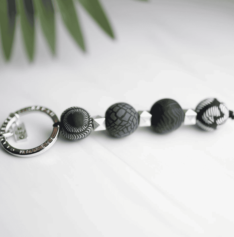 Midnight Palm 4-Ball Keychain with handcrafted dark clay beads, metal spacers, split keyring, charm, and lobster-claw clip.