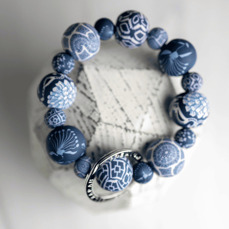 Blue Wrist Keychain with handcrafted clay beads, durable elastic cord, and silver key ring featuring JILZARAH logo.