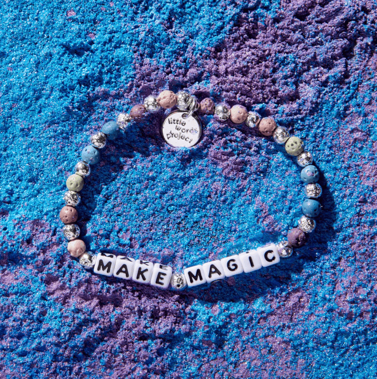M/L bracelet with Make Magic letter beads and matte lava rock beads, designed to strengthen intuition and clear the mind.
