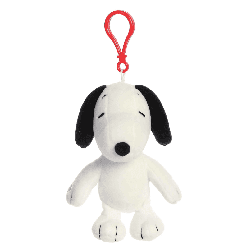 Small white Snoopy plush keychain with red clip, featuring classic Peanuts design and soft fabric by Aurora.