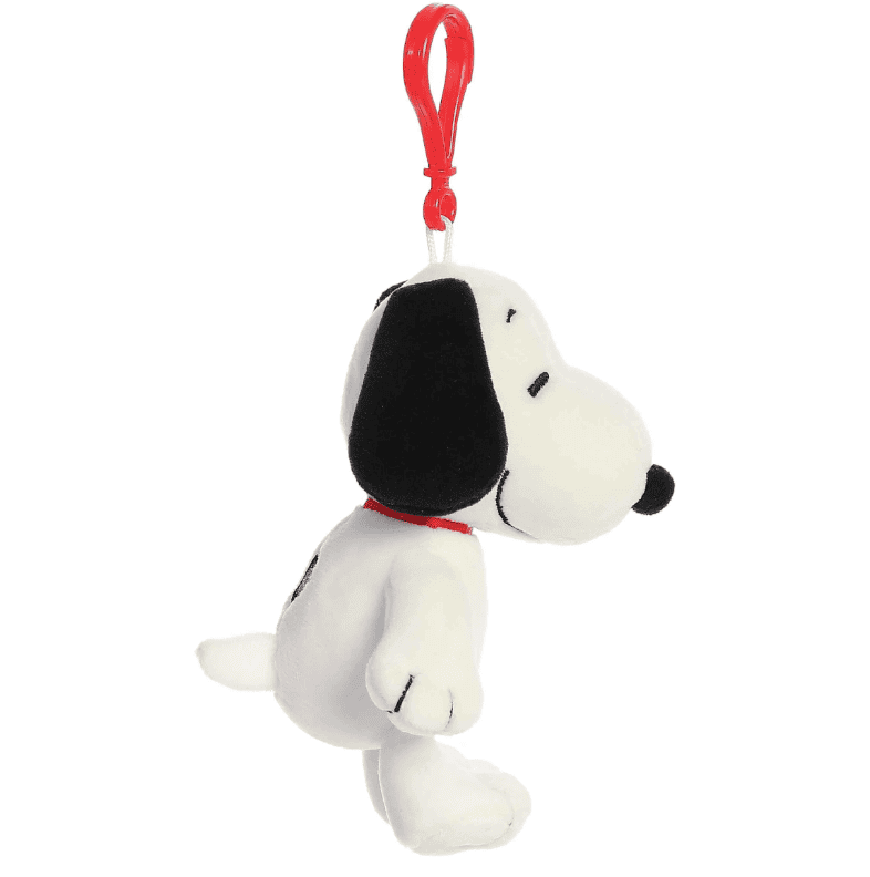 Small white Snoopy plush keychain with red clip, featuring classic Peanuts design and soft fabric by Aurora.