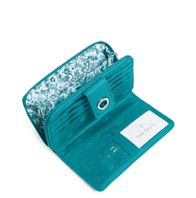 RFID Turnlock Wallet in Forever Green recycled cotton with multiple card slots and secure turnlock closure.
