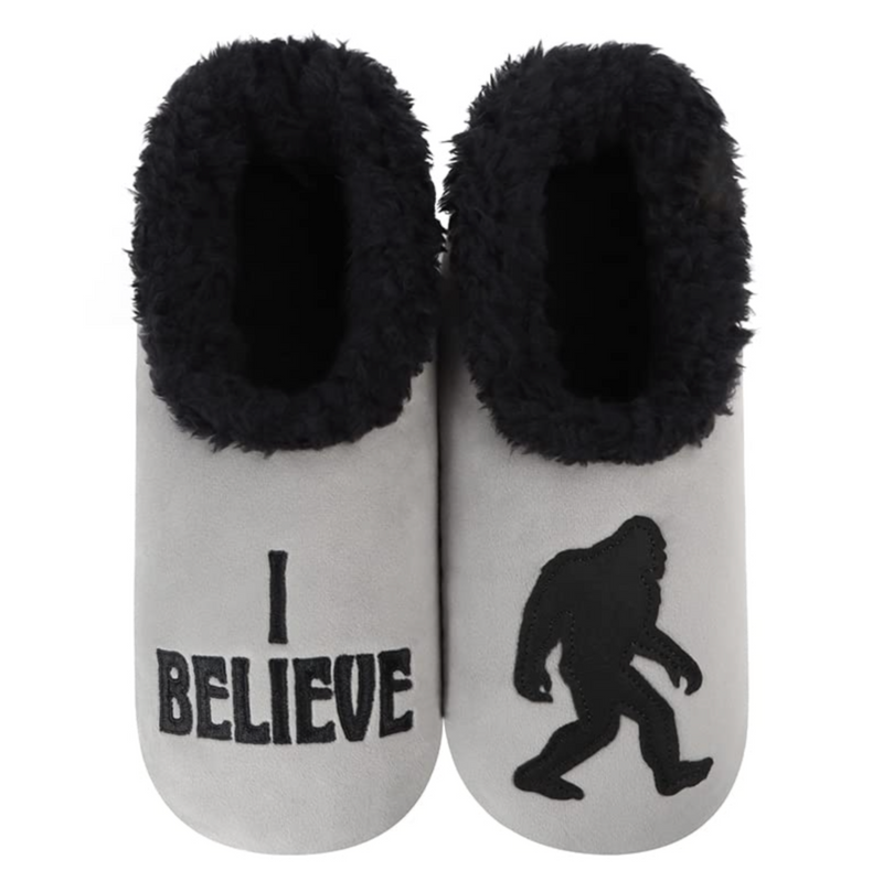 Men’s black cozy sherpa slippers with non-skid soles, “I Believe” pairables by Snoozies.