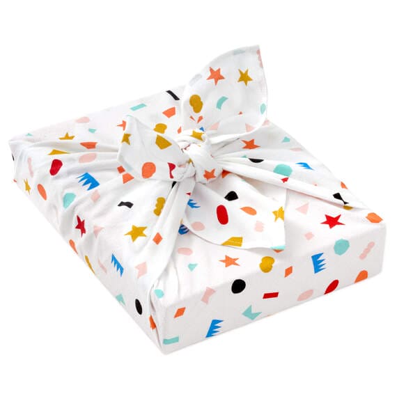 Hallmark 26-inch square reusable cotton fabric gift wrap with multicolor geometric confetti on cream background.


