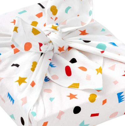 Hallmark 26-inch square reusable cotton fabric gift wrap with multicolor geometric confetti on cream background.

