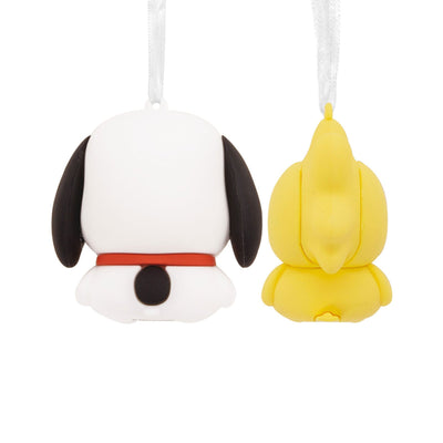 Set of two Snoopy and Woodstock Christmas ornaments. Snoopy, a small beagle dog, is wearing a Santa hat. Woodstock, a small yellow bird, is perched on Snoopy’s head