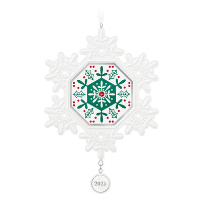 Elegant white porcelain snowflake ornament with red and green accents and red gemstone for 2025