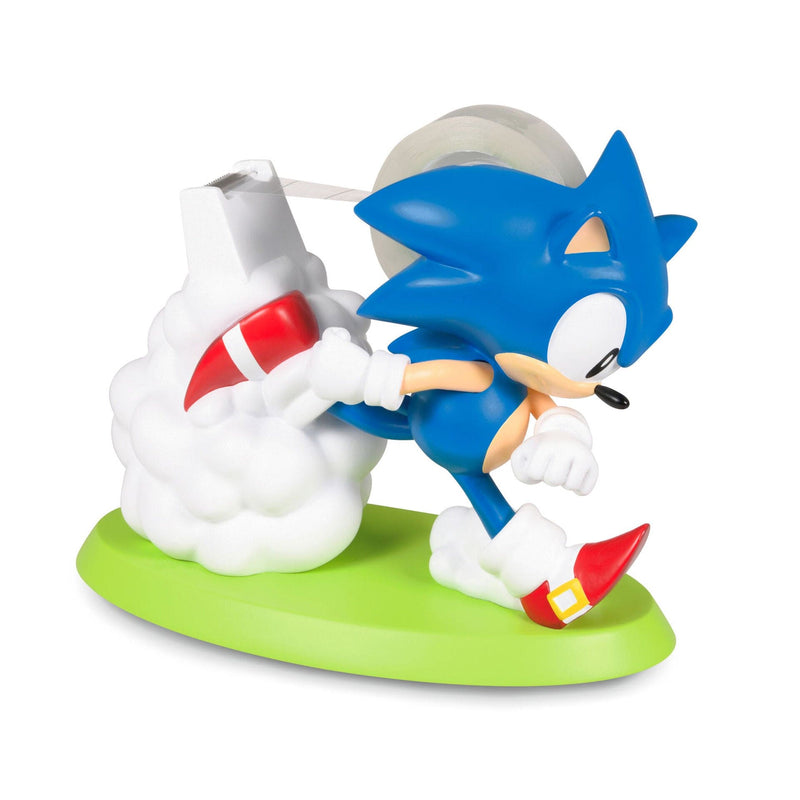 Sonic the Hedgehog tape dispenser with 3D figure and cloud base, fun desk accessory for kids, teens, and SEGA fans.


