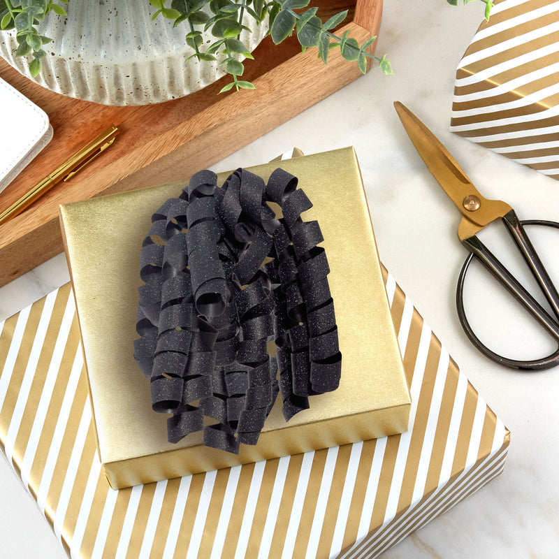 Hallmark black curly ribbon gift bow with sparkling finish and corkscrew-style curls for high volume.