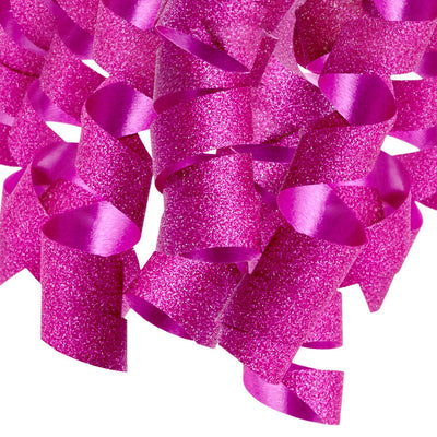 Hallmark pink curly gift bow with glittery corkscrew ribbon strands and self-adhesive backing, perfect for wrapped birthday presents.