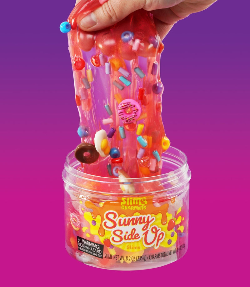 Crazy Aaron’s Sunny Side Up red slime with egg, donut, and croissant charms for fun sensory play that’s squishy, stretchy, and savory-sweet