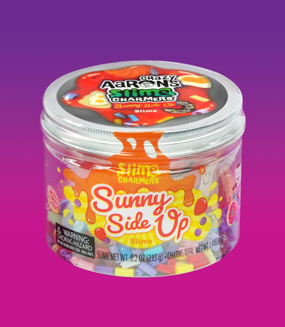 Crazy Aaron’s Sunny Side Up red slime with egg, donut, and croissant charms for fun sensory play that’s squishy, stretchy, and savory-sweet