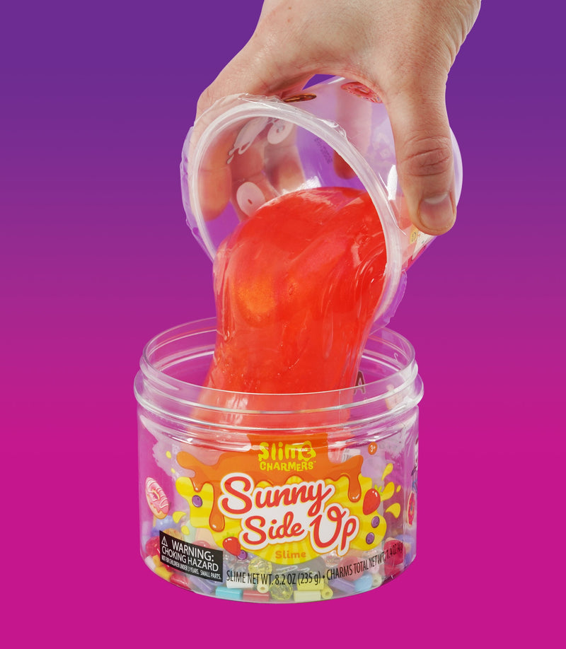 Crazy Aaron’s Sunny Side Up red slime with egg, donut, and croissant charms for fun sensory play that’s squishy, stretchy, and savory-sweet