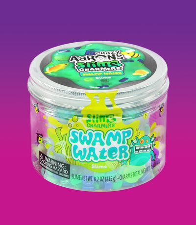 Crazy Aaron’s Swamp Water slime with fish and creature charms in dark green slime for squishy, stretchy, sensory swamp play