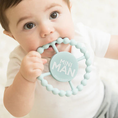 Round blue silicone baby teether with beaded texture and "Mini Man" design, safe for teething and perfect for little hands.