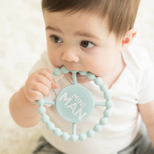 Round blue silicone baby teether with beaded texture and "Mini Man" design, safe for teething and perfect for little hands.