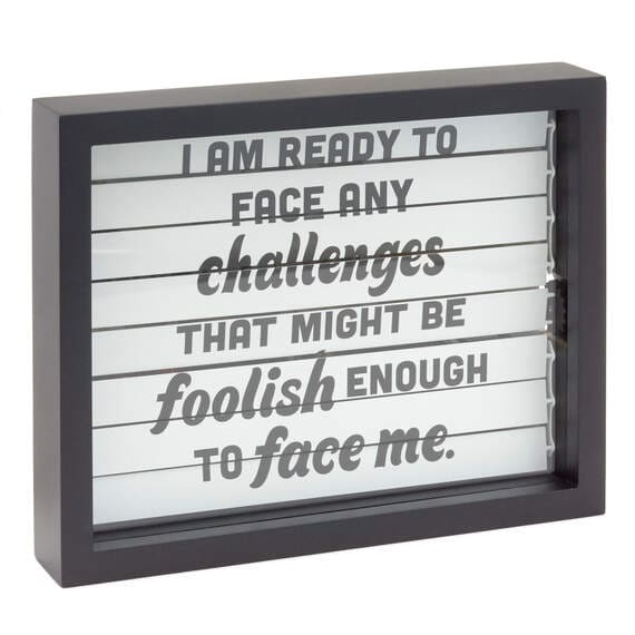 The Office wall decor with Dwight Schrute quote on blinds and hidden illustration revealed by turning a back dial.
