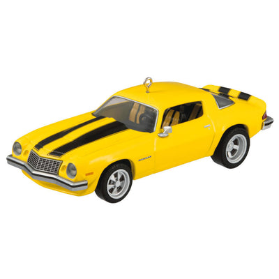 Yellow and black 1976 Chevrolet Camaro ornament from Transformers with turning wheels, representing Bumblebee in Earth vehicle disguise.