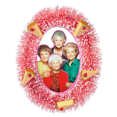 The Golden Girls ornament with photo of Rose, Dorothy, Blanche, and Sophia in pink wreath with strawberry cheesecake slices