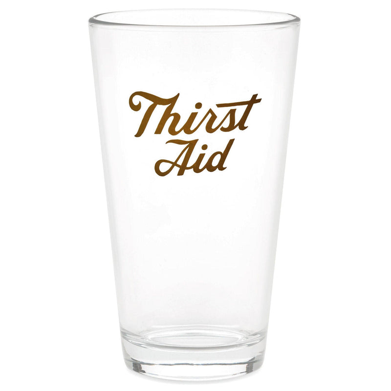 Hallmark clear pint glass with Thirst Aid in gold lettering