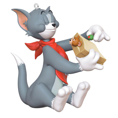Tom and Jerry Christmas ornament with Tom holding a sandwich and Jerry peeking out, red napkin around Tom's neck
