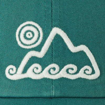 Spruce green six-panel chill cap with waves and sun embroidery, soft washed cotton, adjustable snapback Life is Good label.

