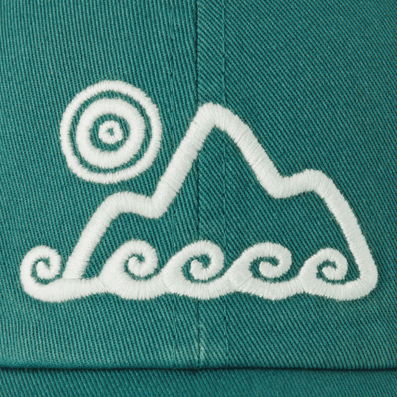 Spruce green six-panel chill cap with waves and sun embroidery, soft washed cotton, adjustable snapback Life is Good label.

