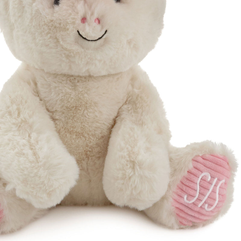 Big Sister unicorn plush toy with white fur, pink corduroy feet, coral mane, and stitched “Big Sis” lettering