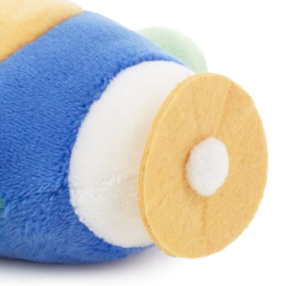 Blue and green stuffed airplane with a yellow propeller. It sits on a white background. Text on the airplane wing reads “H”. Hallmark Zip-Along Airplane Plush Toy.  pen_spark     tune  share   more_vert